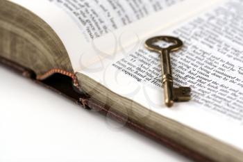 Royalty Free Photo of a Key on a Bible