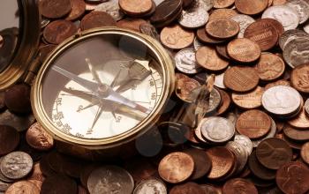 Royalty Free Photo of a Compass and Coins