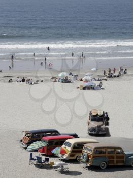 Royalty Free Photo of Classic Woody Cars on the Beach