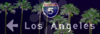 Royalty Free Photo of a Los Angeles Freeway Sign and Palm Trees