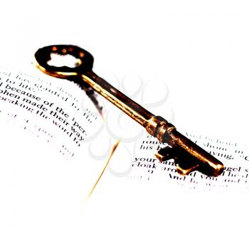 Royalty Free Photo of a Key on a Bible