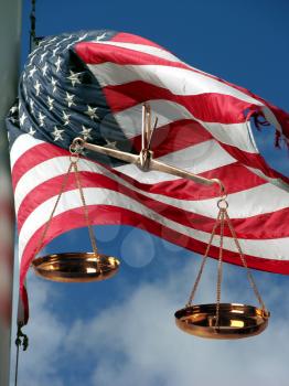 Royalty Free Photo of the Scales Of Justice And American Flag