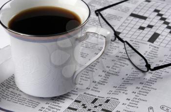 Royalty Free Photo of Hot Coffee And Crossword Puzzle