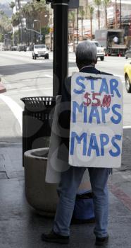 Royalty Free Photo of a Man Selling Star Maps