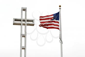 Royalty Free Photo of a Cross and American Flag at War Memorial
