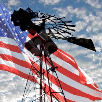 Royalty Free Photo of a Windmill and an American Flag