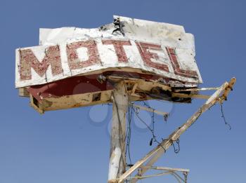 Royalty Free Photo of a Broken Down Motel Sign