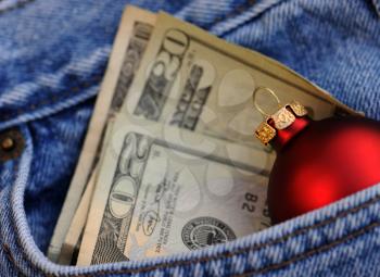 Royalty Free Photo of Money and a Christmas Ornament
