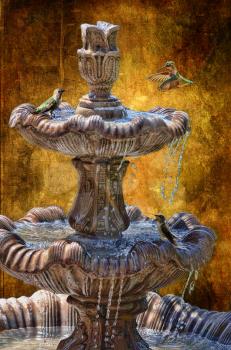 Royalty Free Photo of Hummingbirds at a Fountain