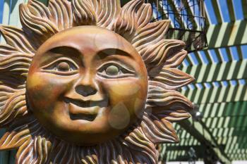 Royalty Free Photo of a Smiling Ceramic Sun