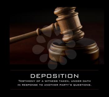 Royalty Free Photo of a Gavel and a Definition of Deposition