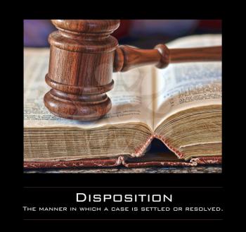 Royalty Free Photo of a Gavel and Book With the Definition for Disposition