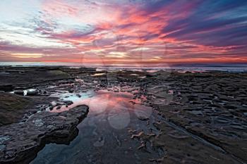 Tidal pools are revealed during low tide at Potholes at Hospitals reef in La Jolla, California, USA.