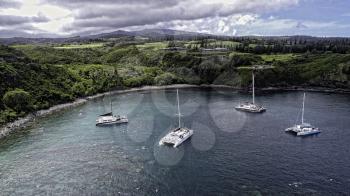 Royalty Free Photo of Catamarans in Honolua Bay, Maui, Hawaii. This is a three image aerial panoramic.