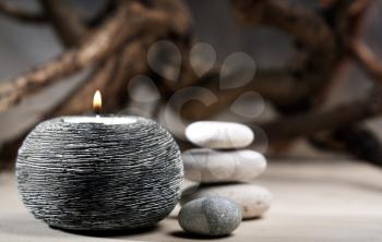 Royalty Free Photo of a Candle and Stone