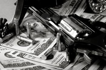 Royalty Free Photo of a Gun and Money