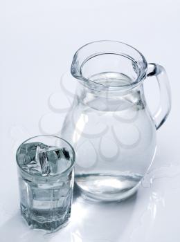 Royalty Free Photo of a Pitcher of Water and a Glass