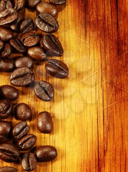 coffee beans on the wooden desk as food background