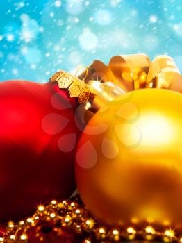 Xmas decoration ball over abstract golden backgrounds with beauty bokeh