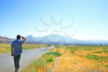 Royalty Free Photo of a Man Walking to Ararat Mountain