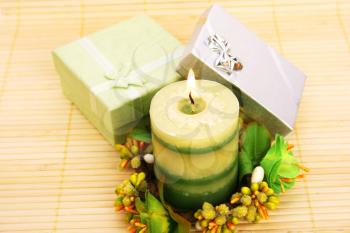 Royalty Free Photo of a Candle andPresents