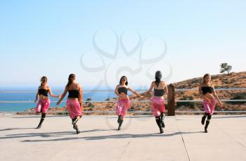 Royalty Free Photo of Dancers by the Sea