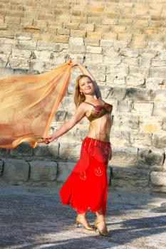 Royalty Free Photo of a Belly Dancer on the Stairs of the Kourion Amphitheatre