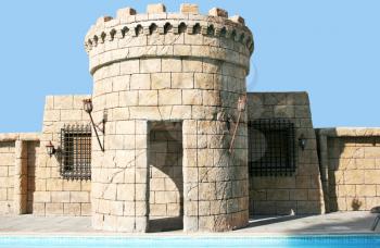 Royalty Free Photo of a Castle Style Building With a Pool
