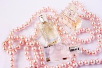 Royalty Free Photo of Perfume Bottles and Pearls