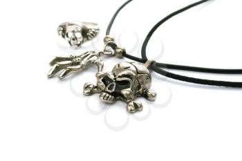 Royalty Free Photo of a Skull Necklace and Ring