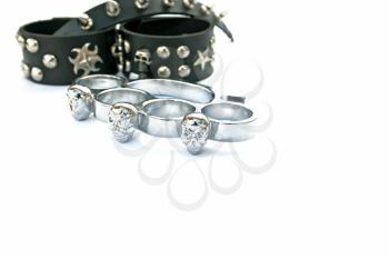 Royalty Free Photo of Brass Knuckles and Leather Bracelets