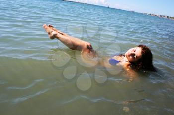 Royalty Free Photo of a Woman Swimming in the Sea