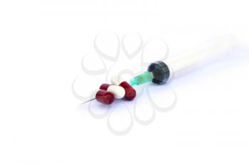 Royalty Free Photo of Medical Pills and a Syringe