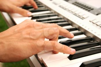 Royalty Free Photo of a Musician Playing the Keyboard