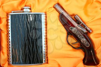 Royalty Free Photo of a Pistol and a Flask