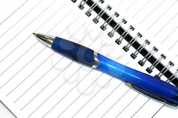 Royalty Free Photo of a Pen on Notebook