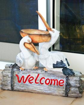 Royalty Free Photo of a Pelican Welcome Sign