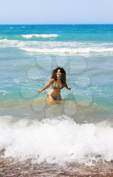 Royalty Free Photo of a Woman Playing in the Sea