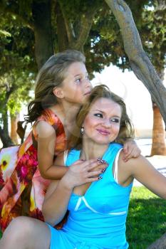 Royalty Free Photo of a Girl Hugging Her Mother