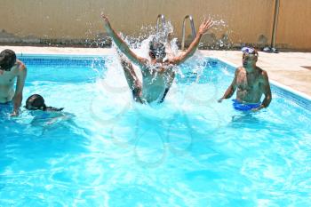 Royalty Free Photo of People Having Fun in a Swimming Pool