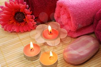 Royalty Free Photo of Candles by Towels