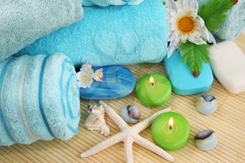 Royalty Free Photo of Soaps and Candles by Towels