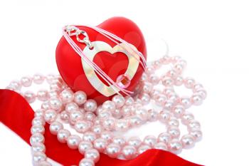 Royalty Free Photo of a Heart and Jewelry