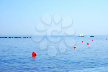Royalty Free Photo of Red Buoys in the Sea