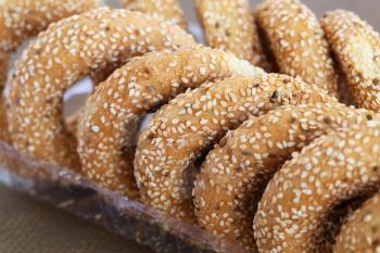 Round rusks with sesame seeads in plastic box.