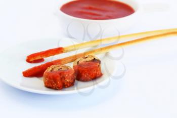 Rusks with sesame seeds, bread sticks and red sauce isolated on gray  background.