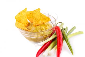 Nachos, guacamole sauce and vegetables isolated on white background.