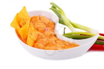 Nachos,  cheese sauce, vegetables isolated on white background.