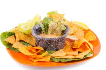 Nachos, lettuce and cheese sauce isolated on white background.
