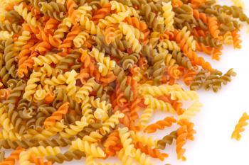 Pile of colorful pasta on white background.